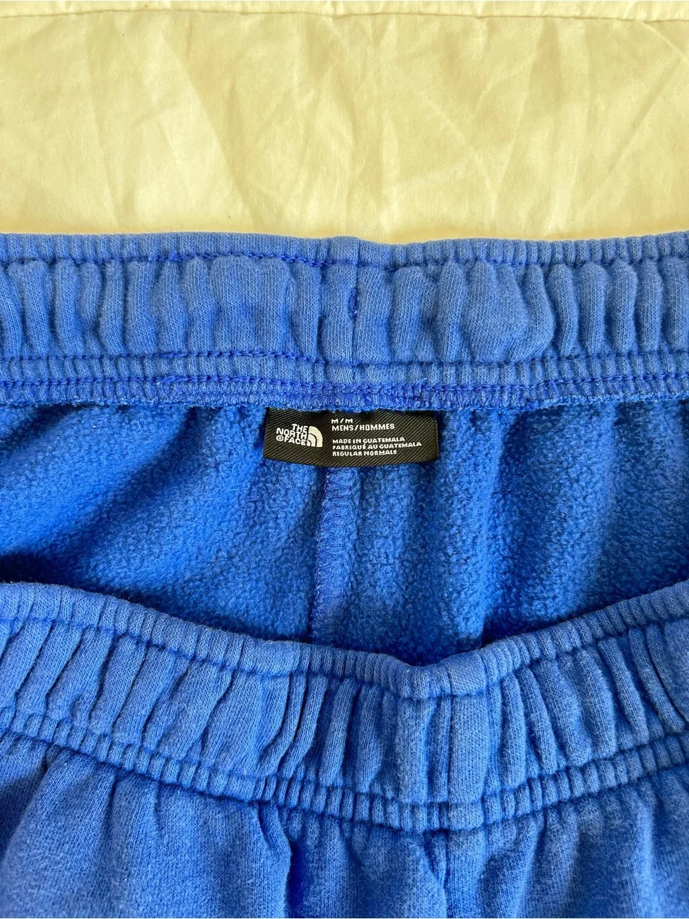 The North Face Men's Royal Blue Athletic Shorts with Red Logo